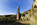 Porth Wen Brickworks site view featuring the crumbling remains of the crushing house and tall chimney, Scheduled Monument on Anglesey, Gwynedd