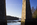 Beautiful view through a stone archway of the World Heritage Site & Grade I Listed building looking towards Britannia Bridge in the distance, Anglesey, Gwynedd