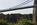 Beach Road springtime view of the suspended section of the Menai Bridge, World Heritage Site, Area of Outstanding Natural Beauty, Isle of Anglesey, North Wales