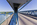 Menai Suspension Bridge scene featuring a view along the pedestrian walkway and main A5 traffic route, Grade I Listed Building, Anglesey, Gwynedd