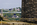 Menai Bridges scene featuring a view of a small section of both the Britannia Bridge and the Menai Suspension Bridge from the banks of the Menai Strait, Isle of Anglesey, North Wales