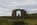 View of the ruins of Llanddwyn Chapel with Twr Mawr Lighthouse in view behind, Llandwwyn Island, Newborough, Isle of Anglesey 