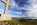 Llanddwyn Island seascape and mountainscape from the cross of St Dwynwen featuring Llanddwyn Bay and Snowdonia, Isle of Anglesey, North Wales
