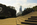 Summertime view from Eakins Oval featuring the tree-lined avenue of Benjamin Franklin Parkway, bronze statues from the Washington Monument & towering skyscrapers of Center City in the distance, Philadelphia, Pennsylvania 