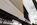 Streetview scene from Pennsylvania Avenue featuring the contemporary exterior of the Newseum museum, Penn Quarter, Washington DC