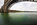 Mainland-side view of the Grade II Listed Britannia Bridge spanning the tidal water of the Menai Strait, Gwynedd, North Wales