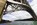 Menai Strait vista from underneath the colossal steel arch of Britannia Bridge looking northwards towards the historic menai Suspension Bridge, Isle of Anglesey, North Wales
